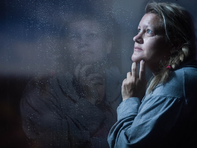 lady looking out a window